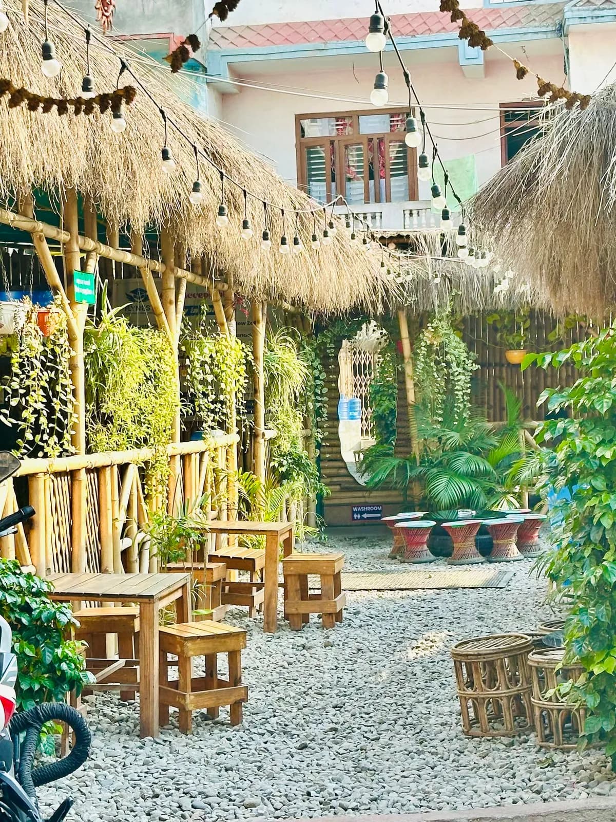 Garden seating under the thatch at Chiya Table